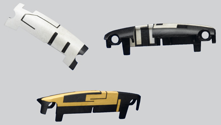 Several sample antennas deposited on plastic parts